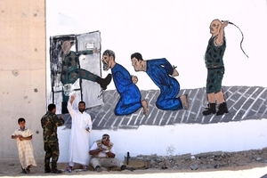 تقرير أصدرته الأمم المتحدة حول التعذيب في ليبيا يورد تفاصيل 11 حالة حصلت في عام 2013 تشير الأدلة فيها إلى تعذيب المحتجزين حتى الموت، ويمر على ذِكر 16 حالة أخرى مشابهة وقعت في عامي 2011 و2012
© MAHMUD TURKIA/AFP/GettyImages