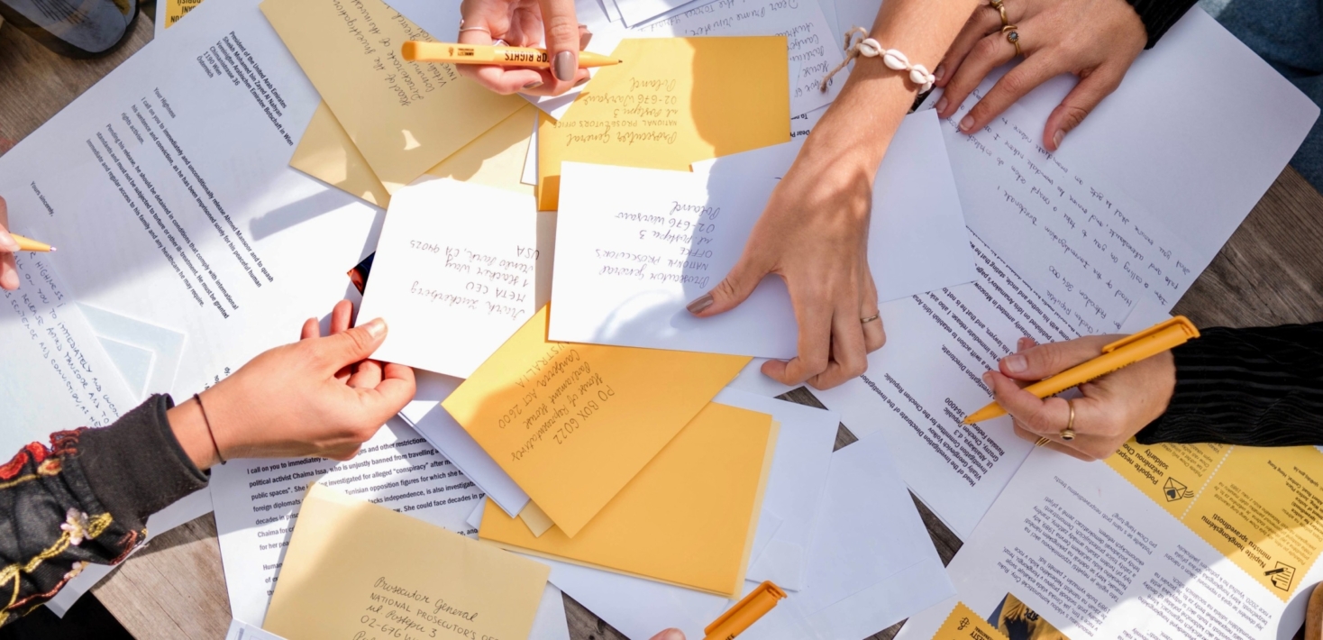 People sort through letters to mark Amnesty's annual campaign Write for Rights