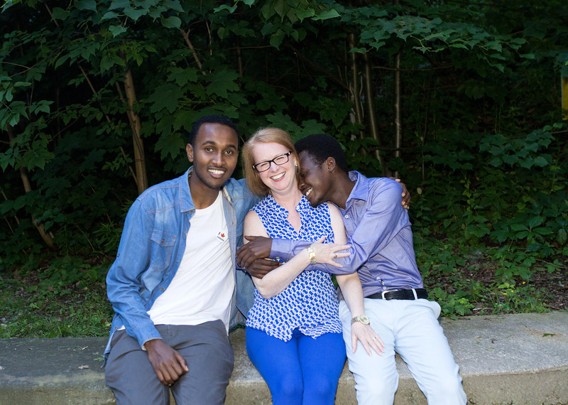 Mohamed Farah from Somalia and Yayha Adam from Sudan with one of their sponsors, Catherine LeBlanc Miller, Toronto, Canada, June 2017. ©Stephanie Foden/Amnesty International