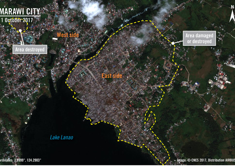 The satellite image from 1 October 2017 shows much of the east side of Marawi city destroyed along with parts of the west side, after the fighting began on May 23rd. 	© CNES 2017, Distribution AIRBUS DS.