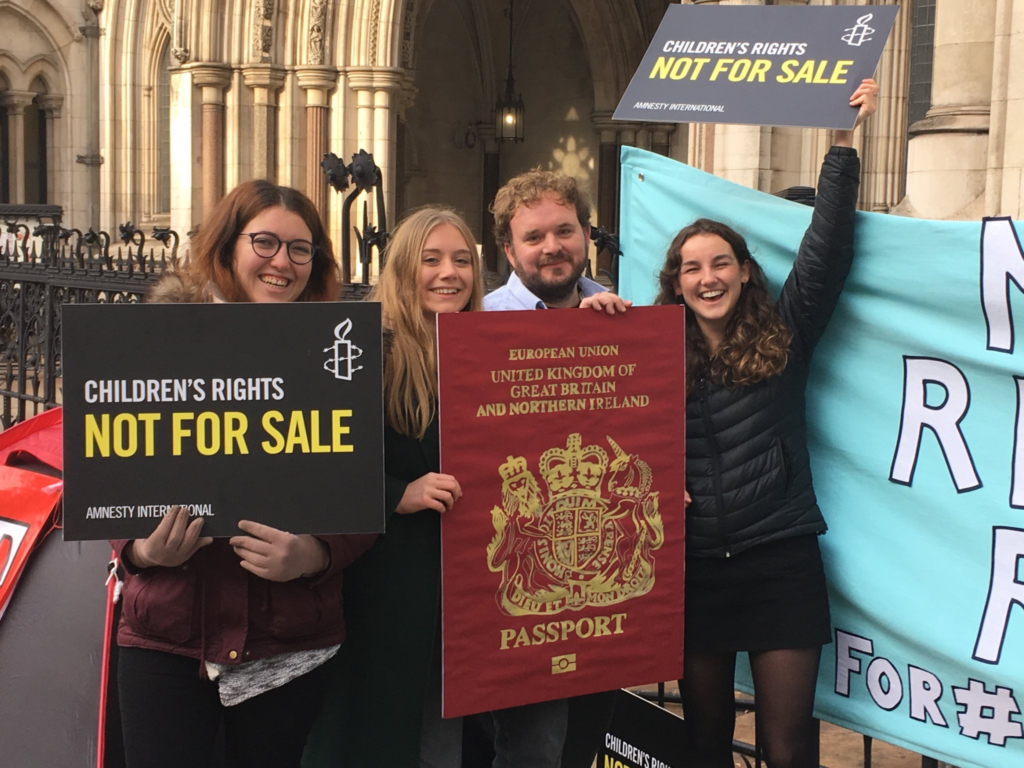 Holly Shorey (second left) and friends campaigning outside UK Parliament. Credit: Private.