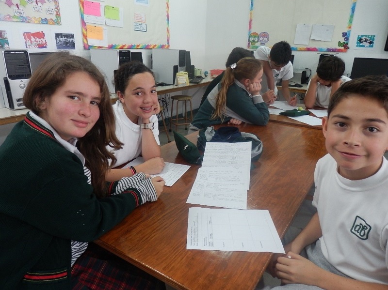 Students Catalina, Paullette and Juan Pablo reflect on their video’s script. Colegio Alexander Bain primary school, Mexico, 2 January 2014. © Amnesty International Mexico.