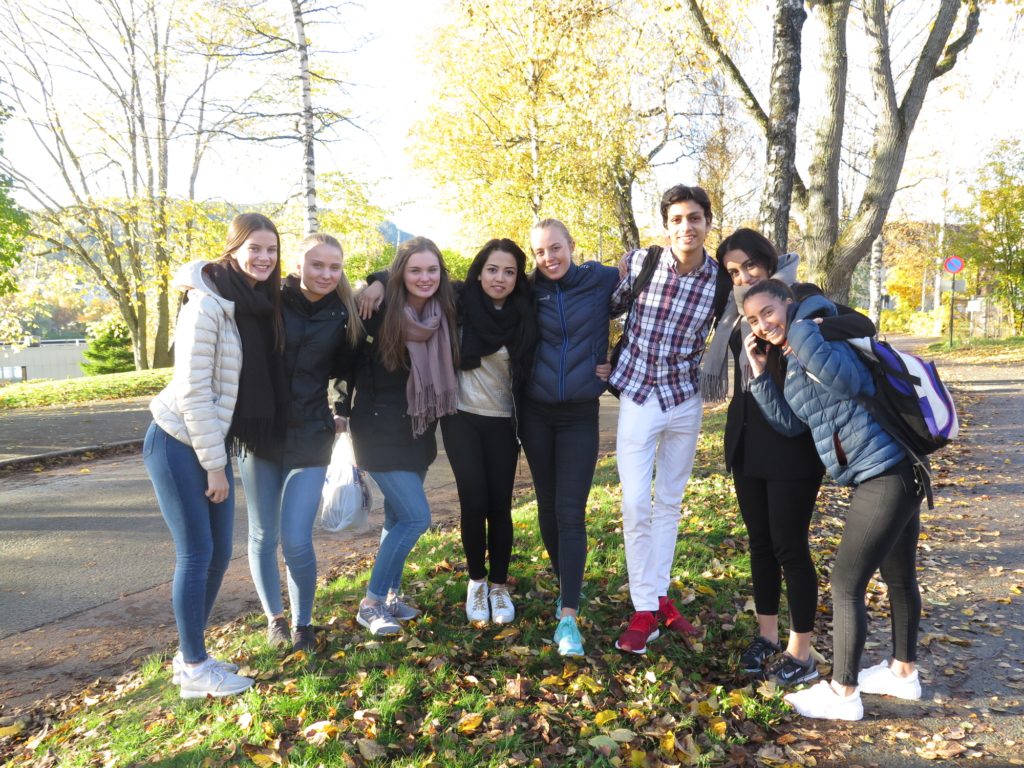 Taibeh Abbasi, 18 (centre), with her friends who organised a huge demo in Norway in solidarity with the Abbasi family