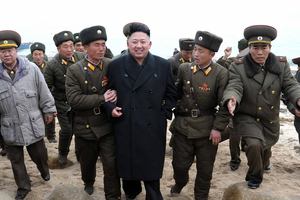 North Korean leader Kim Jong Un, center, walks with military personnel © AP Photo/KCNA via KNS