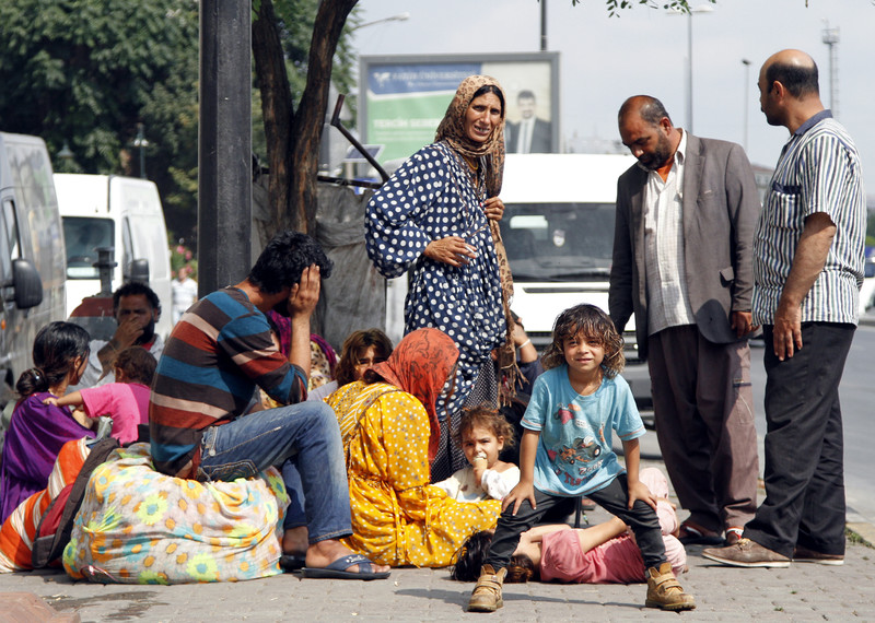 Refugees who fled from Syria and Aleppo sit on a street outside a public park at the Fatih district in Istanbul, Turkey, 18 July 2014, where hundreds of Syrian refugees gathered to stay. While 2.9 million Syrians have fled to Turkey, Jordan, Iraq and Egypt, countries in Europe have only taken in a total of 123,000 people, the office of the UN High Commissioner for Refugees (UNHCR) said in Geneva. UNHCR spokeswoman Melissa Fleming had urged European countries to share the burden. EPA/ULAS YUNUS TOSUN
