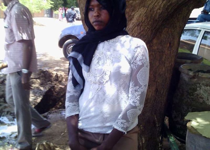 Picture of Fardous Al-Toum , one of the 10 Christian women accused taken outside on 06 July 2015 court where she was charged with wearing 'indecent dress' . She was re-sentenced by the judge accusing her again of indecency and forced to pay a fine of 500 Sudanese pounds ( USD 83) paid by activists. ©Babil Kush