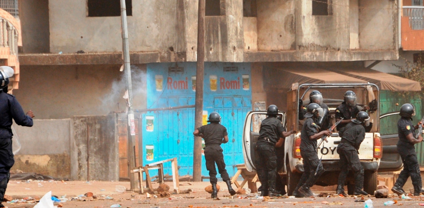 Police officers carrying firearms during a demonstration in the Cosa neighbourhood in Ratoma district, Conakry, on 13 April 2015.