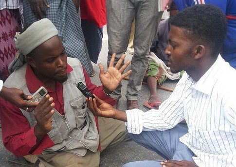 Munaser Mohamed Abdi conducting an interview. Photo credit: Private