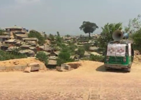 A tuktuk with megaphones attached to broadcast health advice about COVID-19 in the camps. © Al Jazeera English