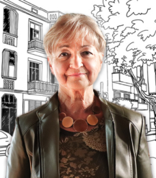 A photo portrait of Erzsébet Diós, a retired criminal judge, looking forward at the camera. There is an illustrated background, in black and white, of a city street behind her.