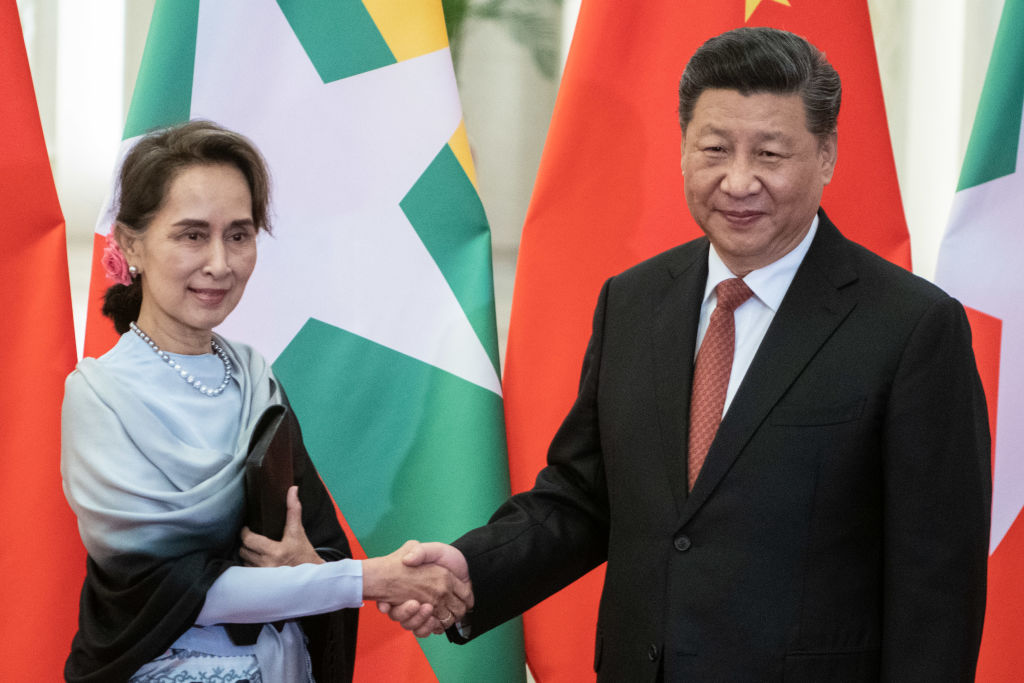 Chinese President Xi Jinping (R) shakes hand of Myanmar State Counsellor Aung San Suu Kyi at the Great Hall of the People in Beijing on April 24, 2019 in Beijing, China.