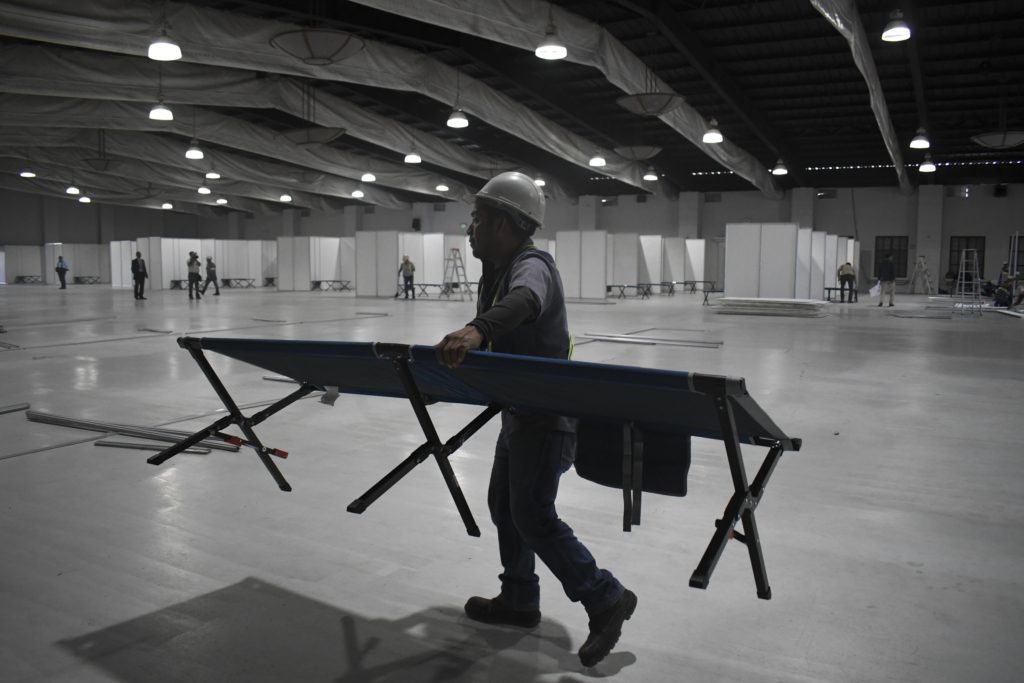 The temporary hospital, with an initial capacity for 319 beds, was set up in an old convention centre in a record 10 days, thanks to a number of large private donations (Photo by JOHAN ORDONEZ/AFP via Getty Images)
