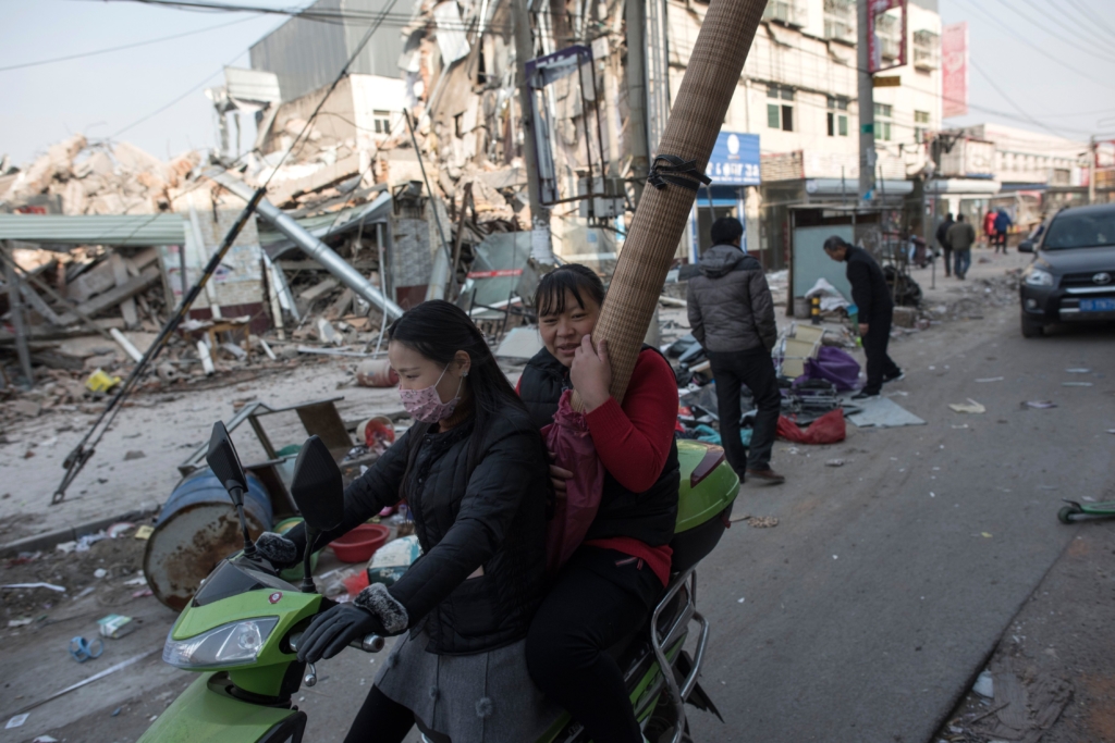 People leaving their homes on the outskirts of Beijing, after receiving eviction notices, in a photo taken on November 27, 2017.