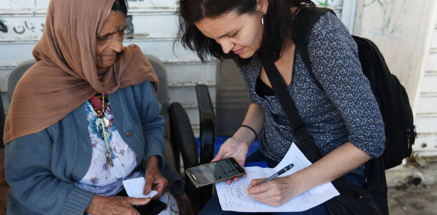 Bibi from Afghanistan talks to senior campaigner Monica Costa Riba on a research mission to the Elliniko camps outside Athens.