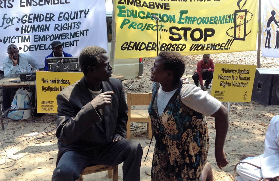 Two actors performing a human rights education performance in Zimbabwe