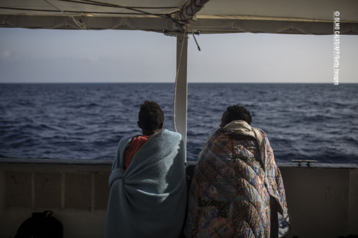 Two refugees on a boat