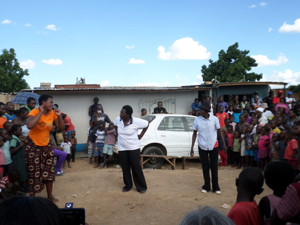 The “All Generations drama group” performing a play. March 2014, Hopley Farm Settlement Harare Zimbabwe. © Amnesty International