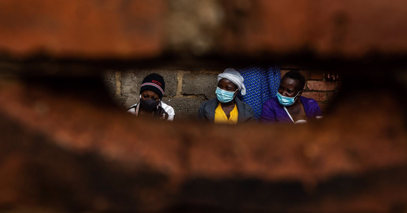 Pregnant women waiting outside a clinic in Harare