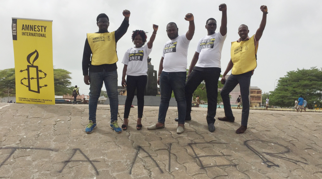 Amnesty activists in Benin wearing Taner T-shirts.