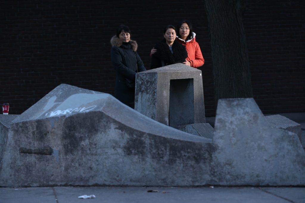 Gu Shuhua and her daughter in Canada with a friend. Credit: Steve Russell/Toronto Star via Getty Images