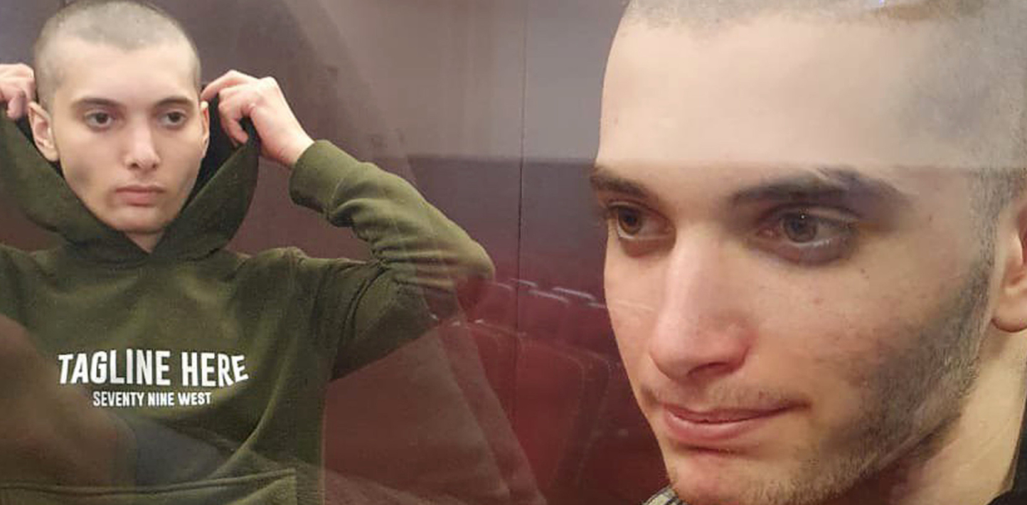 20-year-old Salekh Magamadov and 17-year-old Ismail Isayev, standing inside a glass cell during a court hearing in Grozny.