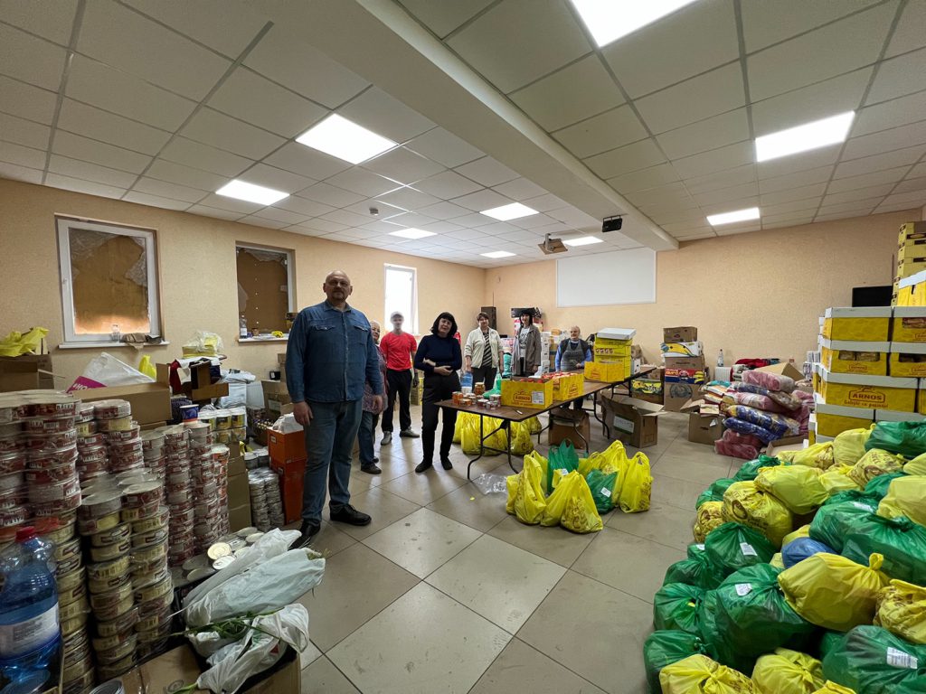 Volunteers at the Holy Trinity Church, which serves as a humanitarian hub and was damaged on 24 March when cluster munitions exploded on the roof.