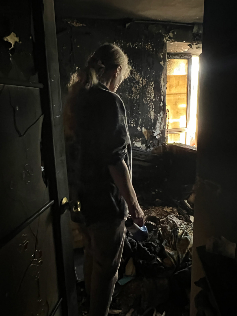 Yurii Chekhonin’s wife in their destroyed apartment.