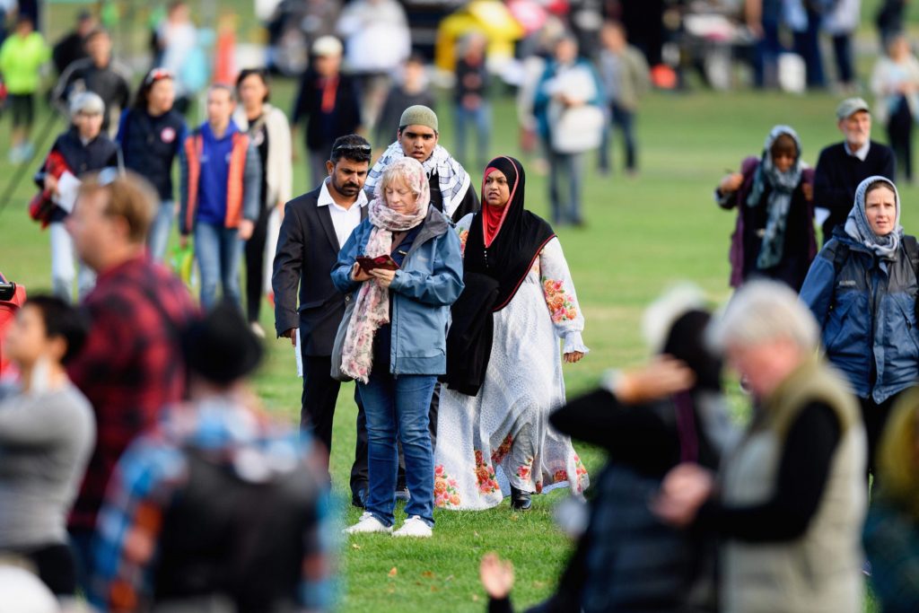 People attend a remembrance service.