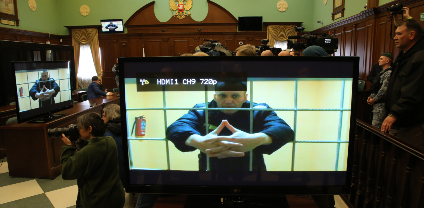 Russian prisoner of conscience as seen on the TV monitor in a court room