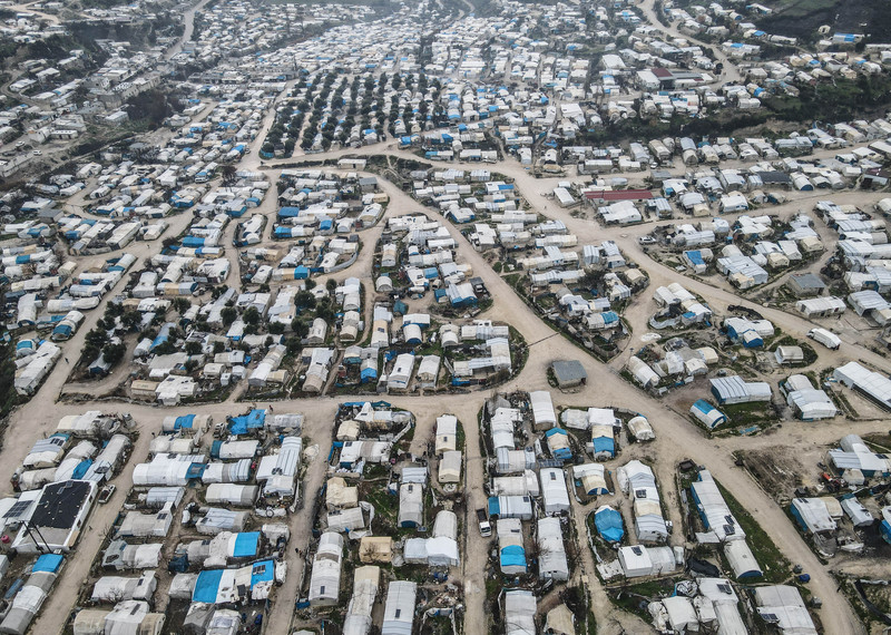 View from above of a refugee camp stretching off into the distance. 