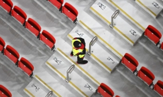 A security guard in a stand at the Qatar World Cup