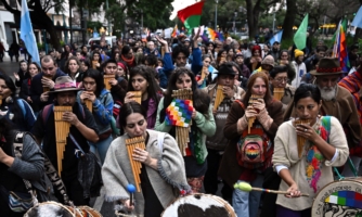 Demonstrators march through Buenos Aires playing panpipes and banging drums, in a protest against Jujuy's Governor Gerardo Morales.