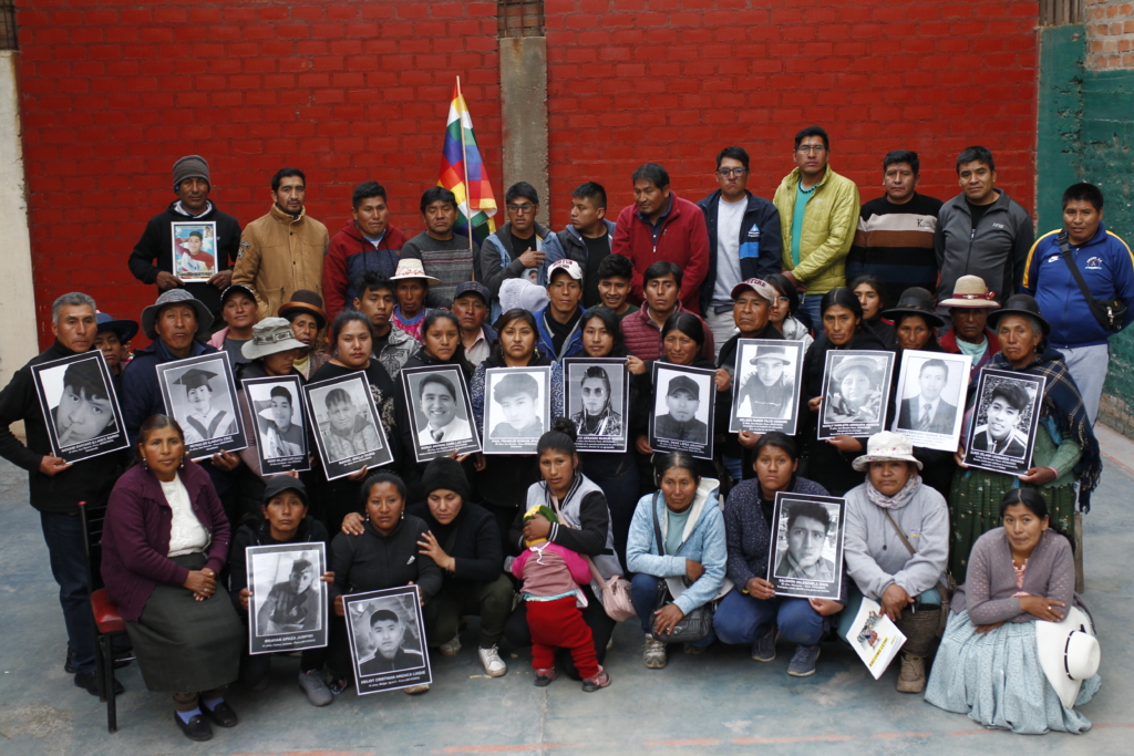 Victims of state repression pose for a photo in Juliaca