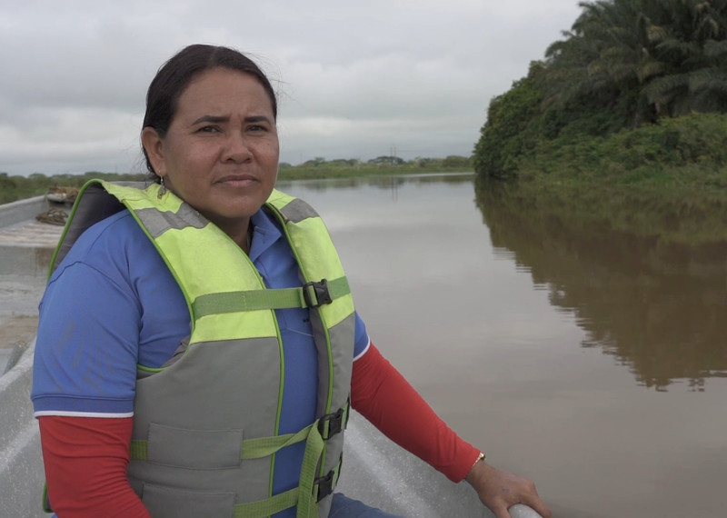 Yuly Velásquez sits on a boat as she carries out research work