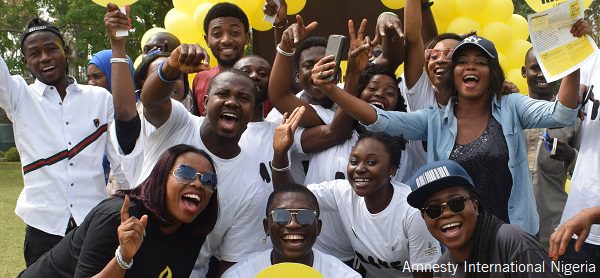 a group of Amnesty supporters cheer