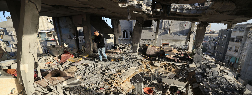 Men check the damages to the house of the Palestinian Nofal family, who were killed during Israeli bombardment, on January 10, 2024 in Rafah in the southern Gaza Strip.