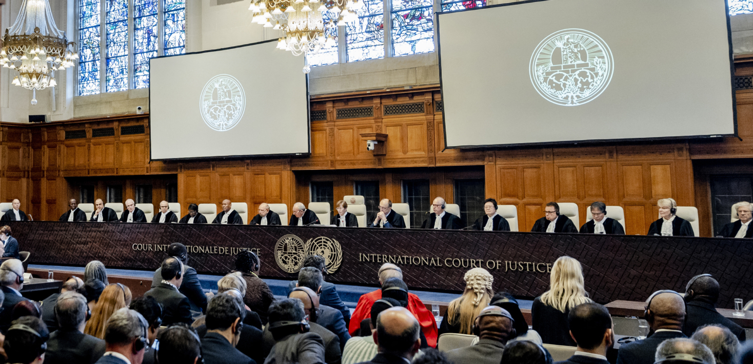 ICJ President Joan Donoghue (C) speaks at the International Court of Justice (ICJ) prior to the verdict announcement in the genocide case against Israel, brought by South Africa, in The Hague on January 26, 2024. The UN top court on January 26, 2024 ordered Israel to allow humanitarian access in Gaza, handing down a landmark decision in a case that has drawn global attention. Israel must take "immediate and effective measures to enable the provision of urgently needed basic services and humanitarian assistance to address the adverse conditions of life faced by Palestinians," ruled the court in its highly anticipated verdict.