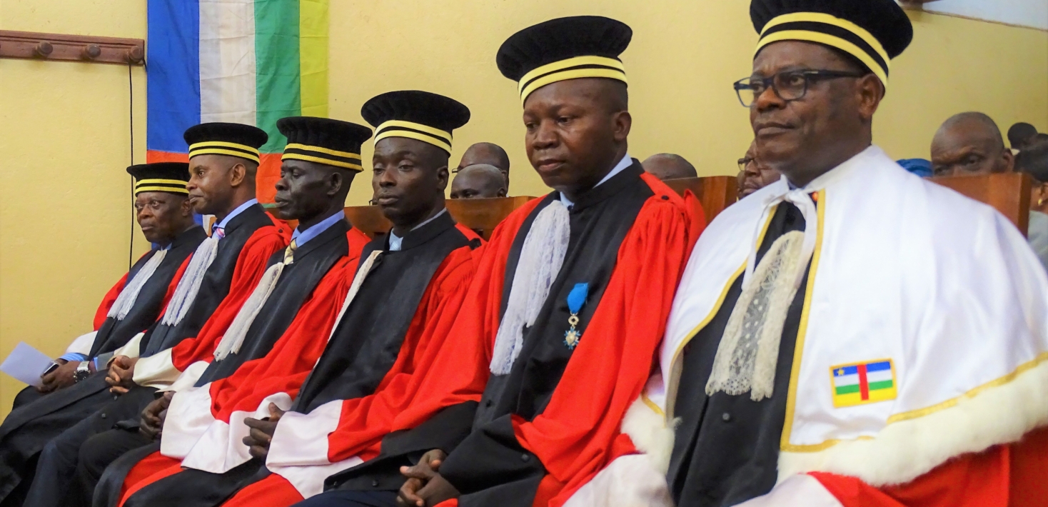 Prosecutor Toussaint Mutazini (R) sits with the five other judges of the Special Penal Court (SPC) at the National Assembly in Bangui