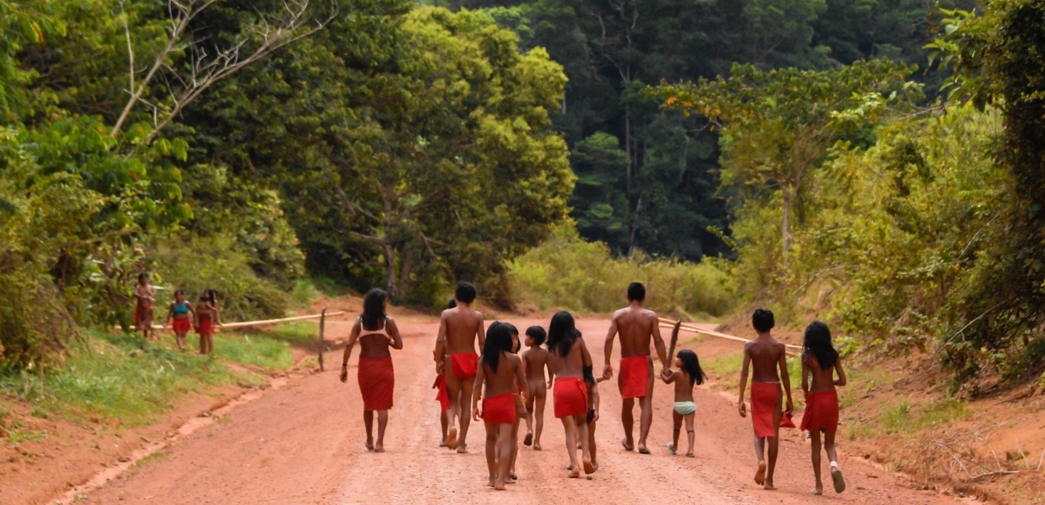Brazilian Waiapi walk on the road of the Waiapi indigenous reserve, at Pinoty village in Amapa state in Brazil