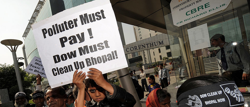 A young protester urges Dow to compensate victims of the Bhopal gas disaster