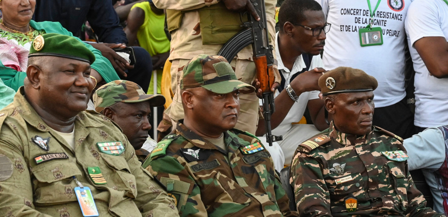 Niger's leaders Colonel Mamane Sani Kiaou (L), General Moussan Salaou Barmou (C) and Colonel Ibroh Bachirou (2-R) attend a CNSP support concert on September 10, 2023.