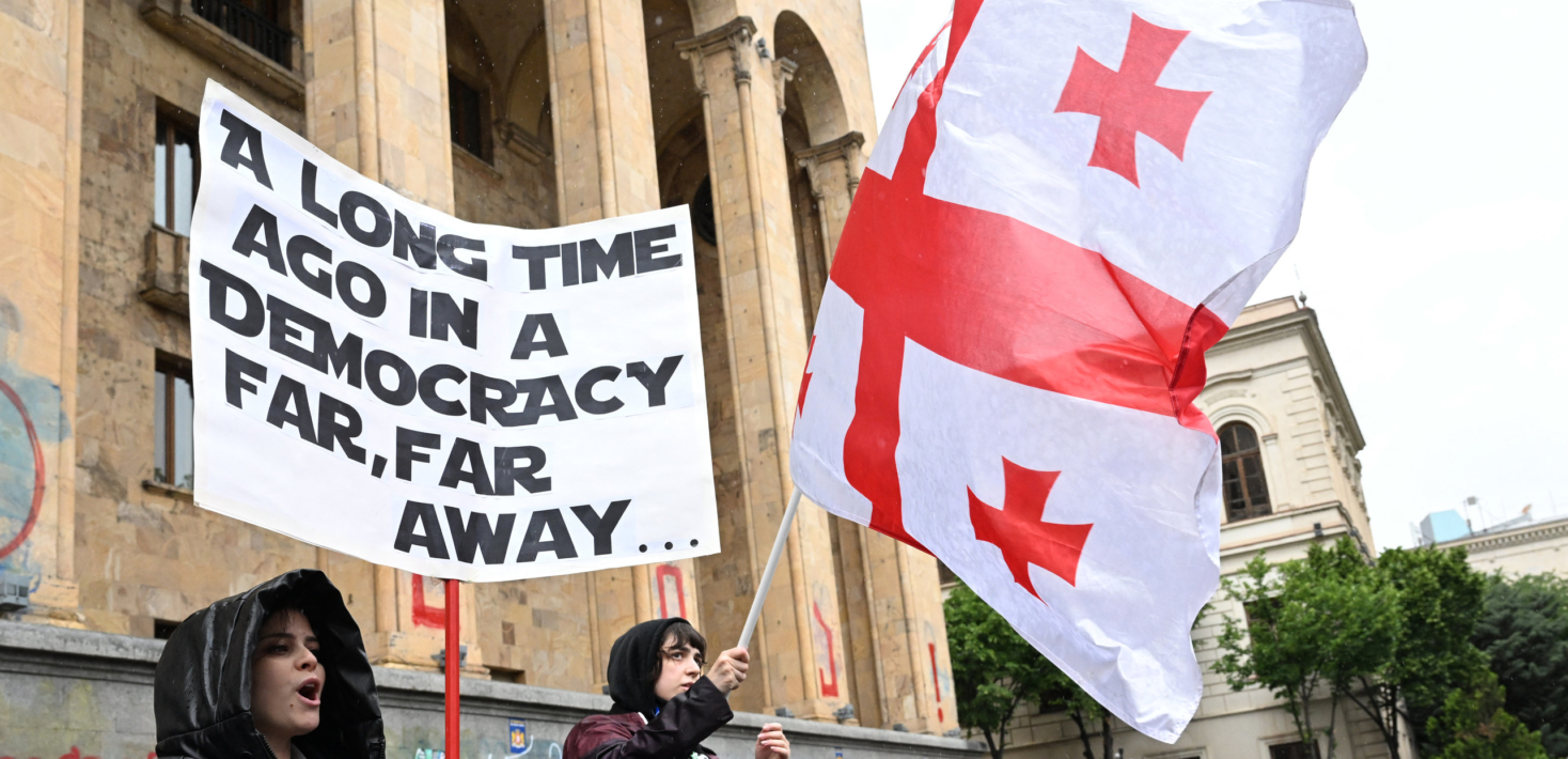 Georgian protesters rally against the controversial "foreign influence" bill in front of the parliament in Tbilisi on May 14, 2024