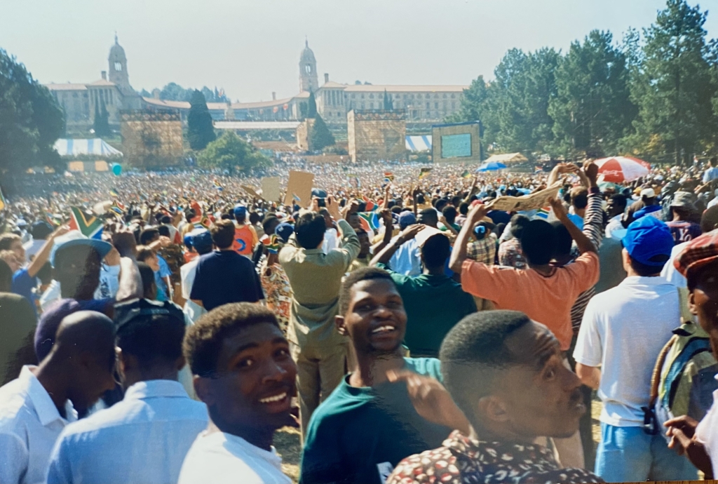 Anticipation mounts in the crowd as they wait for Nelson Mandela to be sworn in as President