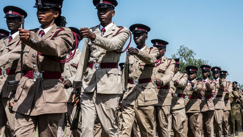 Kenyan police officers wearing ceremonial uniform march during the commemoration of 61st Madaraka Day. A contingent of Kenyan Police is awaiting deployment to lead a Multinational Security Support Mission(MSS) to Haiti.