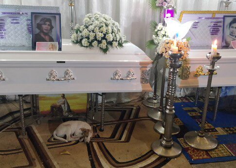 The caskets of brothers Joel and Jonathan Andong sit next to each other during their wake, 2 March 2019, San Jose del Monte, Bulacan, Philippines. Police say the two men alongside a third person allegedly pulled firearms and shot at the police during a “buy-bust” operation in February, but witnesses disputed the account, saying the three men were not even in the same place when undercover police operatives first showed up at the house where the bodies ended up being found.