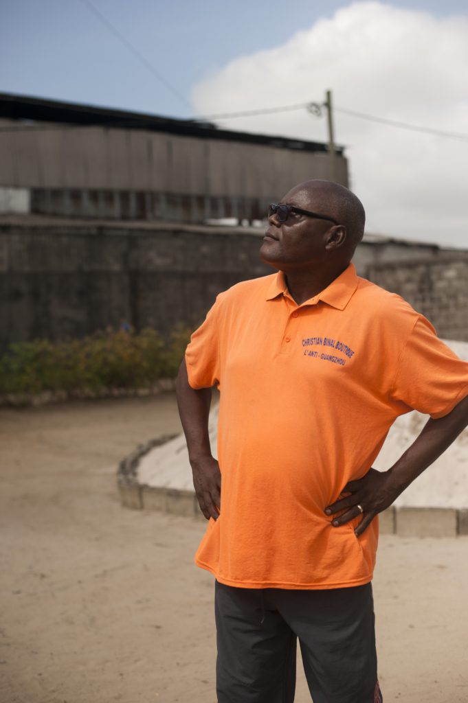 Cyrille Traoré Ndembi standing at his house by the Metssa Congo plant in Vindoulou, Republic of Congo
