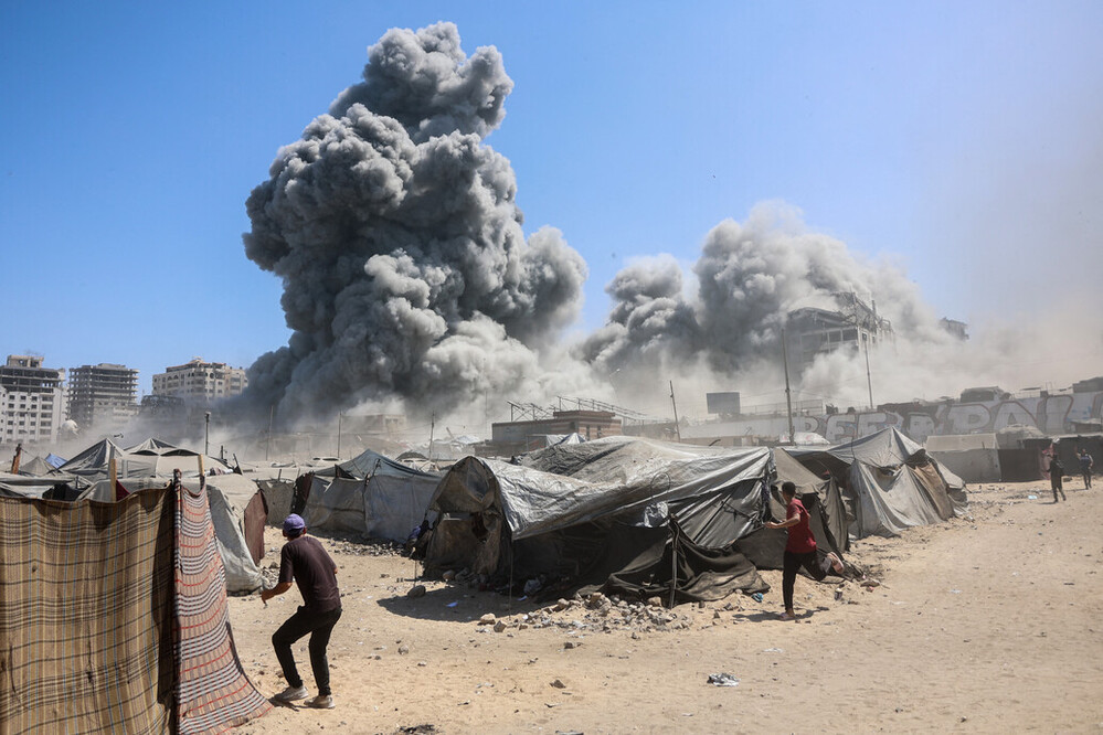 Smoke billows in Gaza City after Israeli strikes on a tower in Gaza 