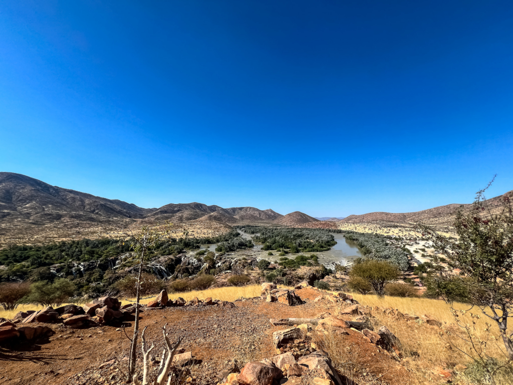 The Kunene River that divides Angola, left, and Namibia, right, © Amnesty International, 2025