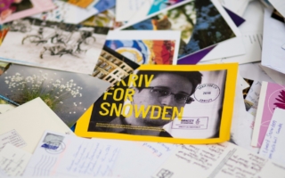 a pile of letters and postcard sent into support of Edward Snowden during Amnesty's Write for Rights campaign