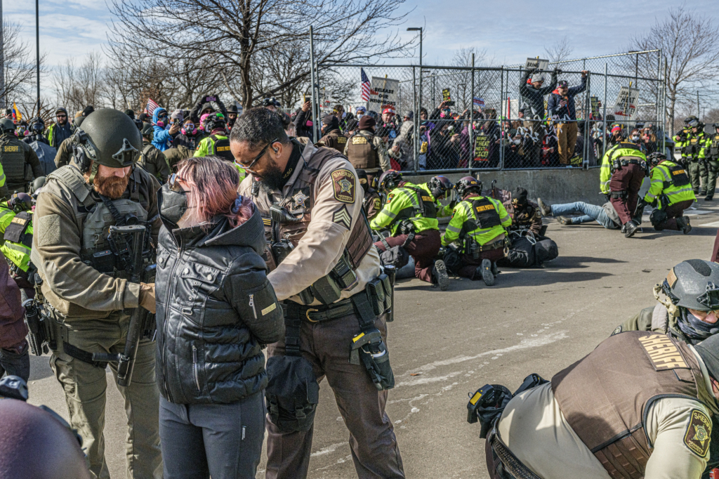 A person is handcuffted by authorities in the USA